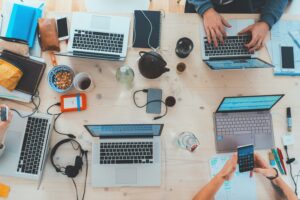 birds eye view of laptops on a cluttered table