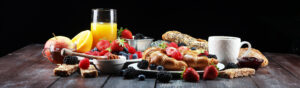 Breakfast spread against a black background