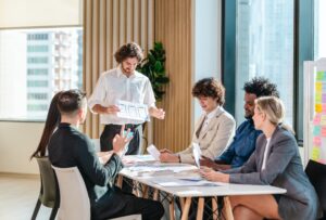 A team sat round a table discussing user journey